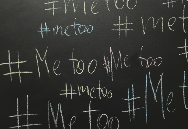Black chalkboard with #MeToo written multiple times.